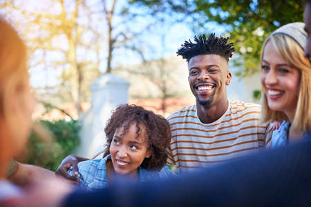 We got this, academic success is ours. a group of students hanging out together outside on campus.の写真素材