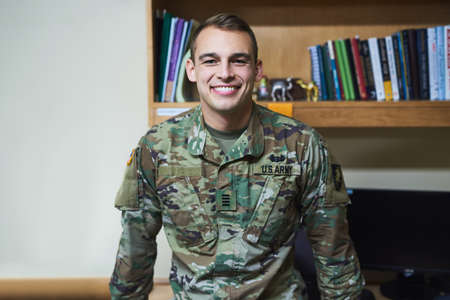 The start of a career in the special forces. a young soldier in the dorms of a military academy.の写真素材