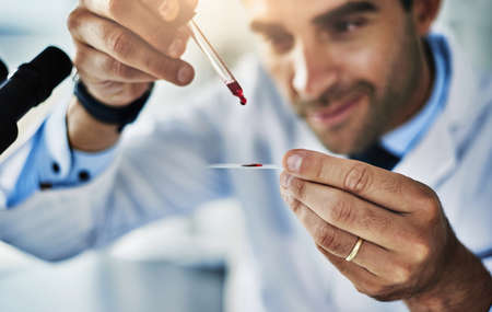 One drop holds so many details. a scientist analyzing medical samples in a lab.