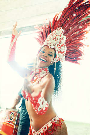 The undeniable seduction of samba. a beautiful samba dancer performing at a carnival.の写真素材