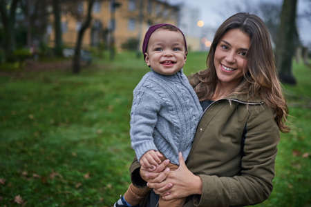 Hes growing up so quickly. Portrait of a mother bonding with her little son outdoors.