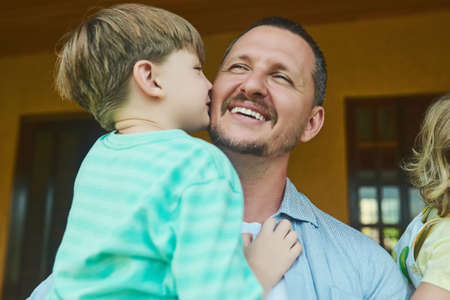 My dad, my hero, my best friend. an adorable little boy kissing his father on the cheek in the...