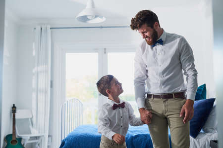 Making Dad look good from day one. an adorable little boy and his father dressed in matching outfits.の写真素材