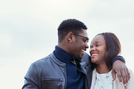 To see you smile is all that I want. an affectionate young couple bonding together outdoors.の写真素材