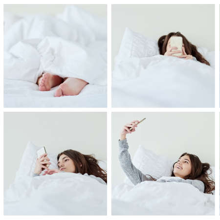 Just me and the bed today. Composite shot of an attractive young woman busy with her phone while lying in bed at home during the day.の写真素材