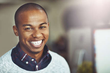 Proud with how far Ive come in my career. Portrait of a young businessman standing in an office.