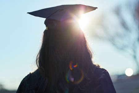 Who knows what the future holds. Rearview shot of a student on graduation day.