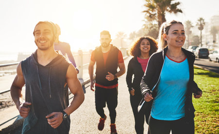 Miles fly when youre having fun. a fitness group out running on the promenade.
