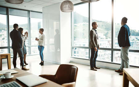 They are the top players of the business. group of businesspeople walking around and having casual...