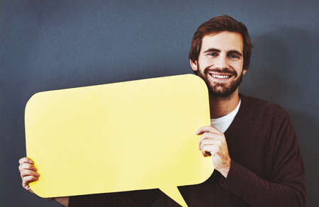 Get your thoughts out there for everyone to see. Studio portrait of a young man holding a speech...