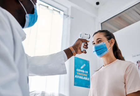 Covid, doctor and safety of healthcare professional scanning patient at the hospital or clinic at...