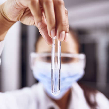 This could be the cure. a young scientist working in a lab.の写真素材