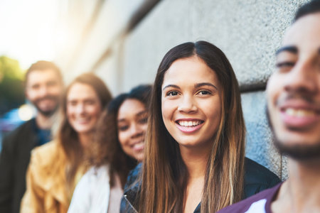 Its going to be a fun day. friends standing together while out in the city.の写真素材