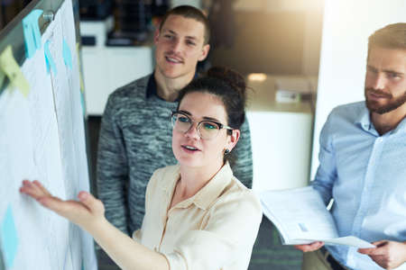 We need to string in our best efforts for this. a group of businesspeople brainstorming in an...