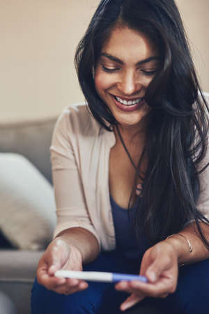 Motherhood is an experience Ive always wanted. a young woman looking happy while taking a pregnancy...