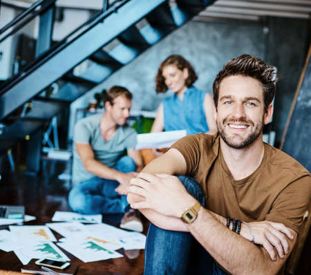 Weve been leading the industry with our innovative ideas. Portrait of a young designer sitting in an...