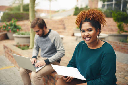 Exams are approaching and Ill be ready. High angle shot of two young university students studying on...