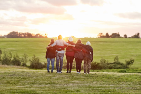 Moments like these make life worth living. Rearview shot of a group of friends admiring the view together on a weekend getaway.の写真素材