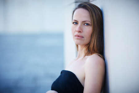 Confidently beautiful. Cropped portrait of an attractive woman posing outside.の写真素材