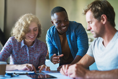 How a mobile app is born. a diverse group of businesspeople collaborating on a project in a modern...