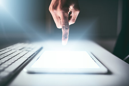 Just a simple touch is all it takes. Closeup shot of an unrecognizable man using a tablet while...