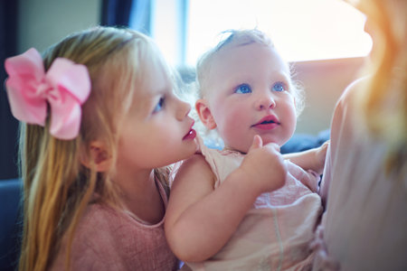 Mom, perfect in her daughters eyes. two adorable sisters bonding with their mother at home.