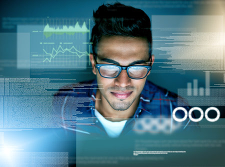 Delving deep into the data. a young computer programmer working on source code.の写真素材