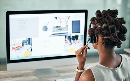 Online, business and support of a professional customer service consultant or agent on a call at work. Internet, web and remote services of female helping client navigate through company website.の写真素材