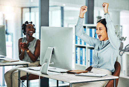 Excited, celebrating and working customer service agent happy about job success and promotion. Call centre web help, support and helpdesk worker with headset celebrate a career win or big bonusの写真素材