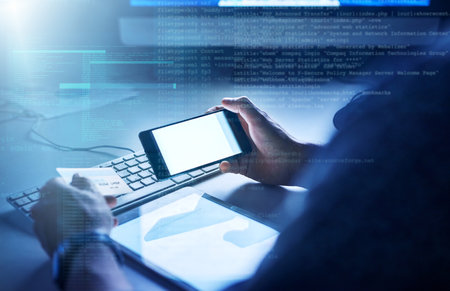 Running security checks on your banking app. an unrecognizable male programmer at work.の写真素材