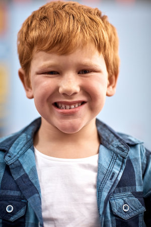 Hes got a smile filled with so much sweetness. Portrait of an elementary school boy.の写真素材