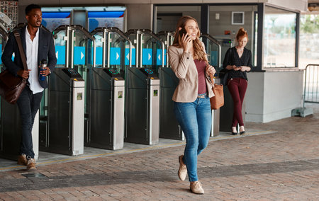 Business woman talking on phone call, commuting on training or bus and walking in urban city. Happy person with smile making conversation, calling a taxi cab and connecting with people online in townの写真素材