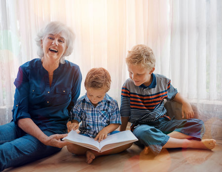 Shes always entertained with them around. a senior woman spending time wither her grandsons.