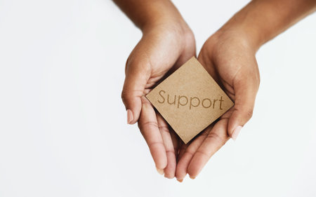 Its for a good cause. an unrecognizable woman holding a blank card.