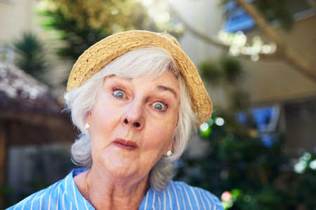 Fabulously funny at any age. a senior woman at home.の写真素材
