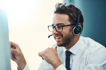 Excellent service, excellent business. a call centre agent working in an office.の写真素材