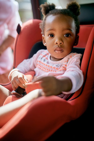 Safety first. Cropped portrait of an adorable little girl sitting in a carseat.の写真素材