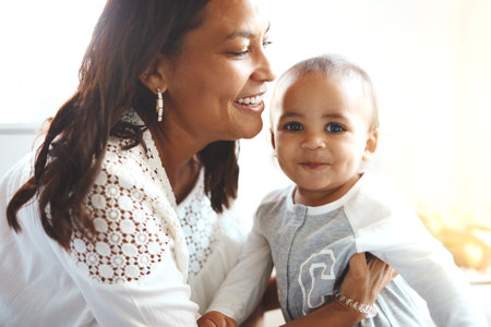 Hes such a friendly little guy. a mother with her adorable baby boy.の写真素材