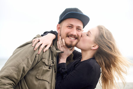Her love is all that I need. an affectionate young couple spending time together outdoors.の写真素材
