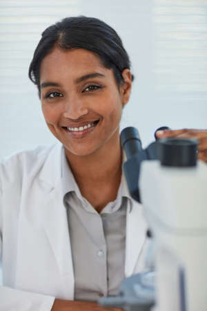 My theories which Ive tested are all correct. Portrait of a young female scientist working in a lab.の写真素材