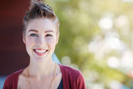 Success is what you make of it. Portrait of an attractive young businesswoman standing on her office...