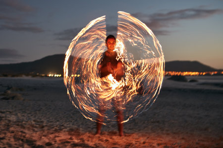 Add a little sparkle to your life. Portrait of a happy young man playing with a sparkler on the...