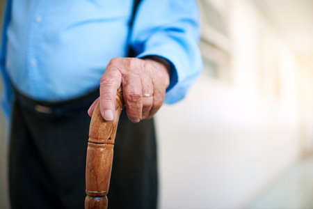 Find a support you can rely on. an unidentifiable senior man holding a cane while walking down a...