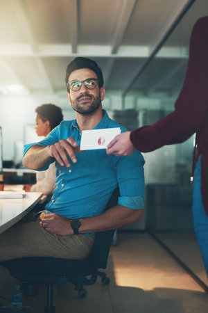 For me. a handsome businessman receiving a love note from a secret admirer.の写真素材