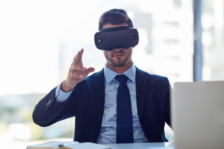 Meeting in virtual space. a businessman wearing a VR headset while working in his office.の写真素材