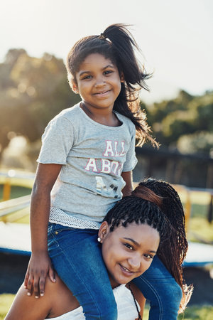 She loves playing in the park. Cropped portrait of a mother bonding with her daughter outdoors.の写真素材