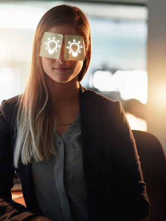 I could use a good idea right now. a young designer with adhesive notes covering her eyes sitting in...
