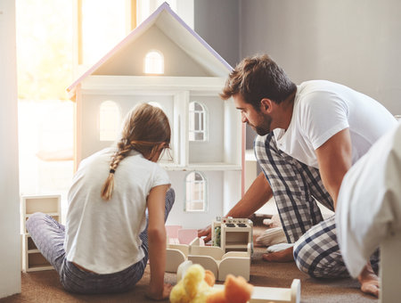 Get to know your children by playing with them. a father spending quality time with his little daughter at home.の写真素材