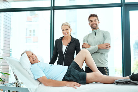 Well work together to get him better. a senior man going for physiotherapy.の写真素材