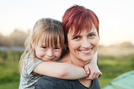 Mommy is my best friend. Cropped portrait of a little girl and her mother standing outside.の写真素材